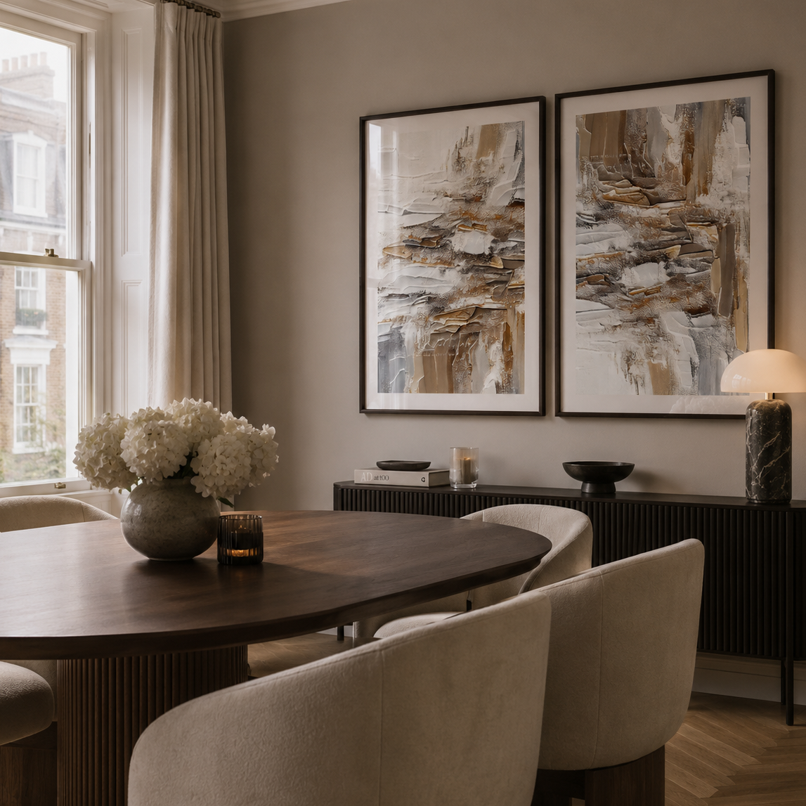 Dining room with a wooden table, chairs, and abstract art on the wall.