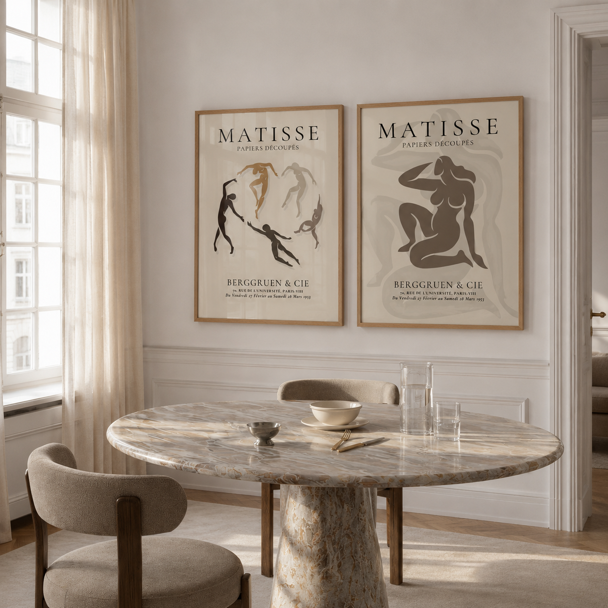 Dining room with marble table and chairs, featuring Matisse art prints on the wall.