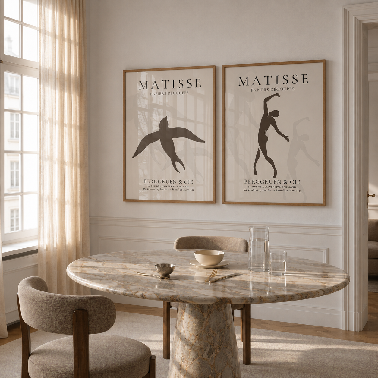 Dining room with marble table and chairs, featuring Matisse art prints on the wall.