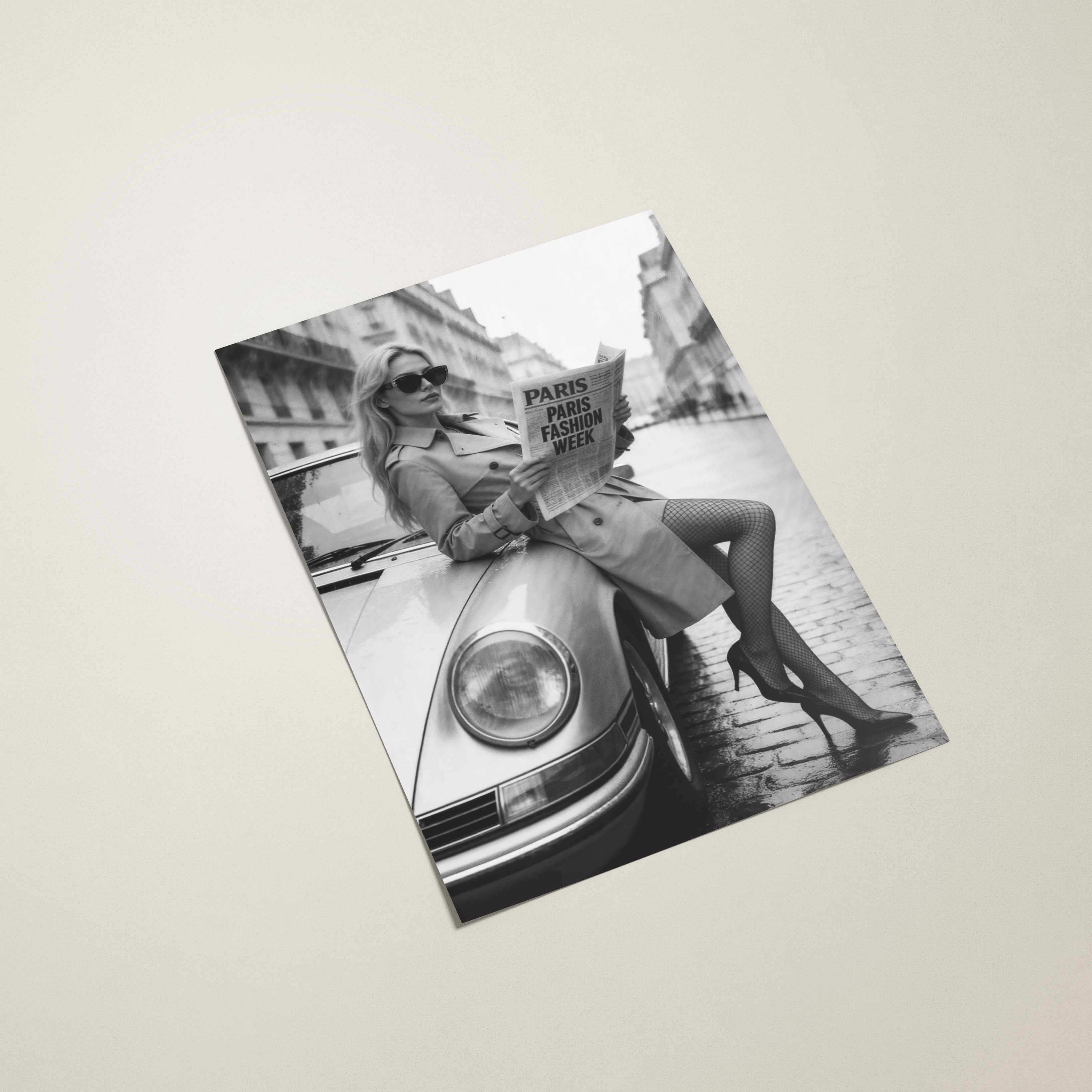 Black and white photo of a woman sitting on a car with a newspaper, displayed on a light gray background