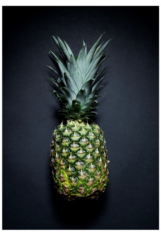 Single pineapple on a black background