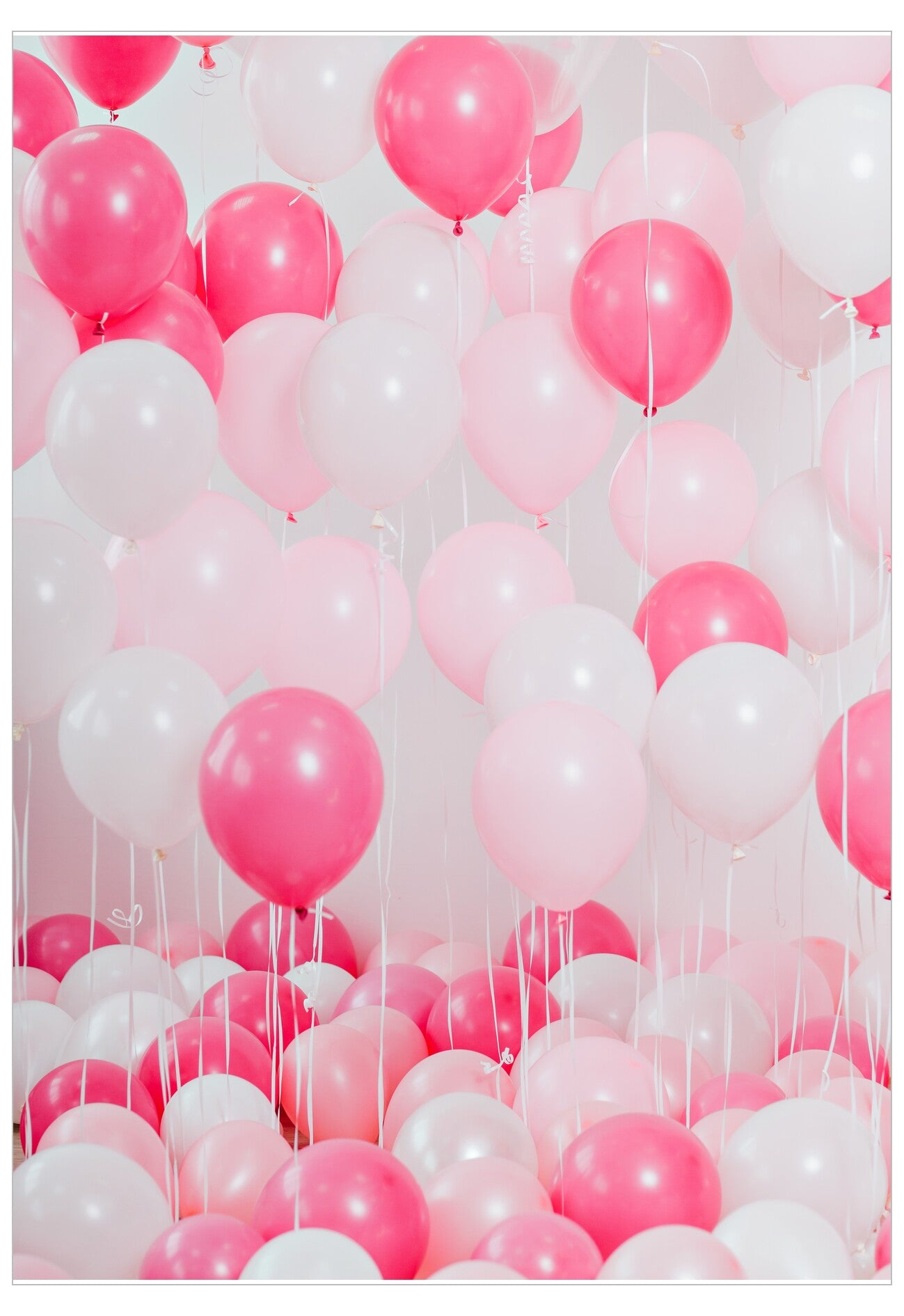 Wall decorated with pink and white balloons