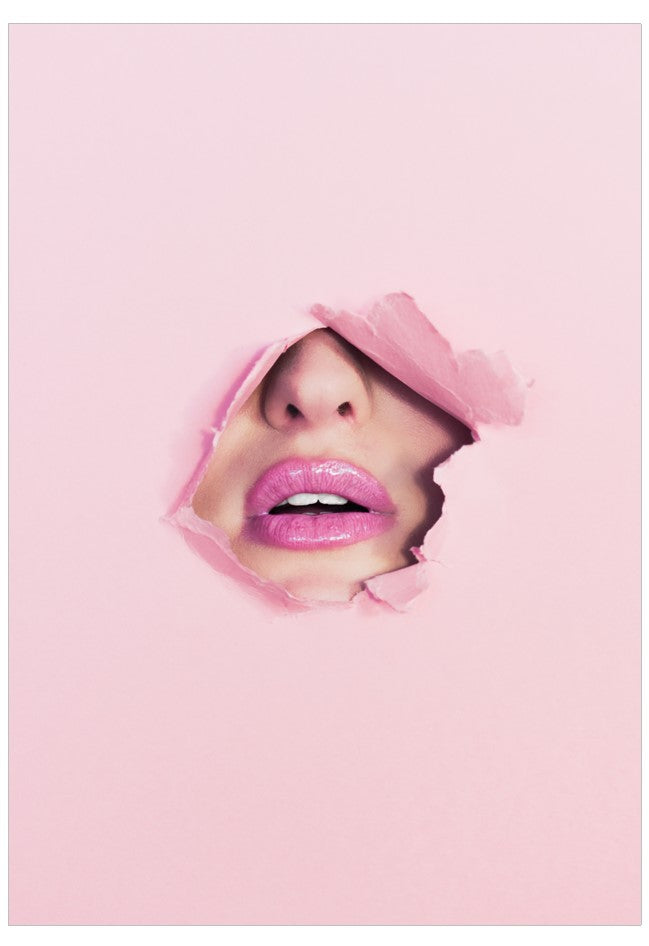 Person wearing a pink hijab with a pink background