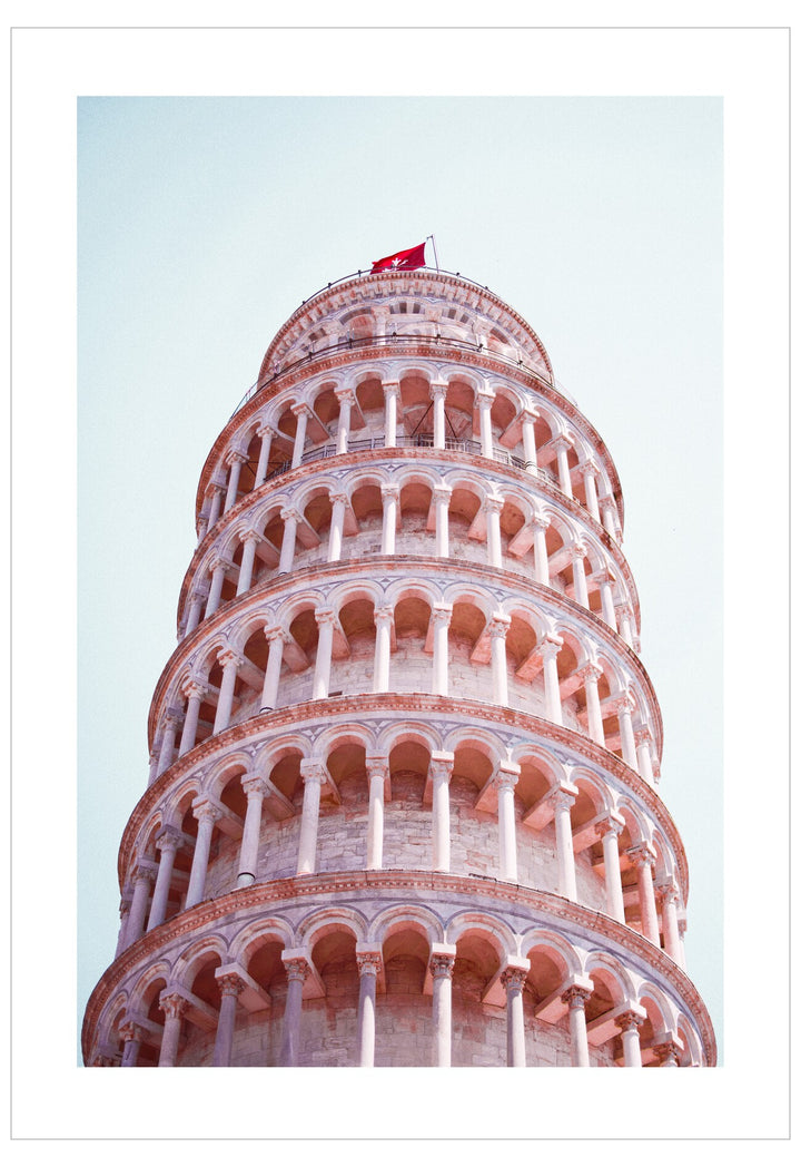 Leaning Tower of Pisa against a light blue sky