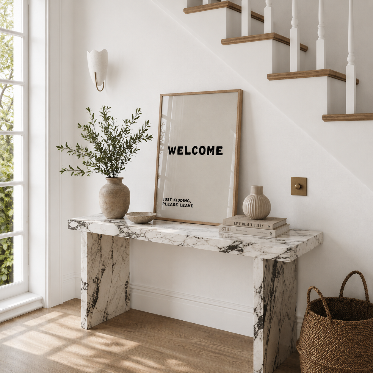 Marble console table with decorative items in a home setting
