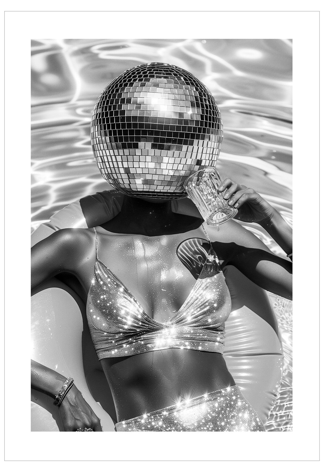 Person wearing a reflective outfit with a disco ball held above their head, surrounded by water.