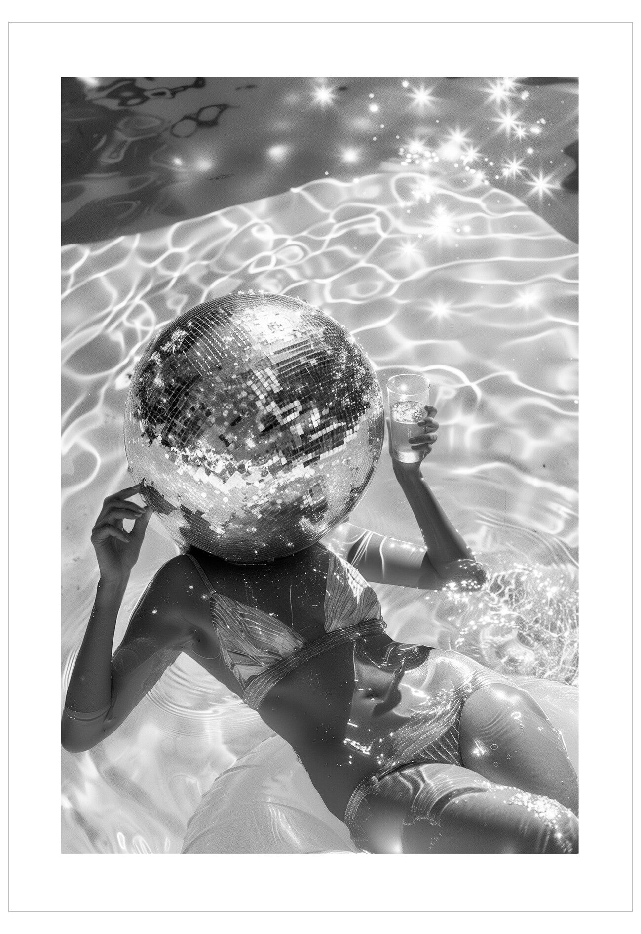 Person holding a disco ball in a pool with sparkles