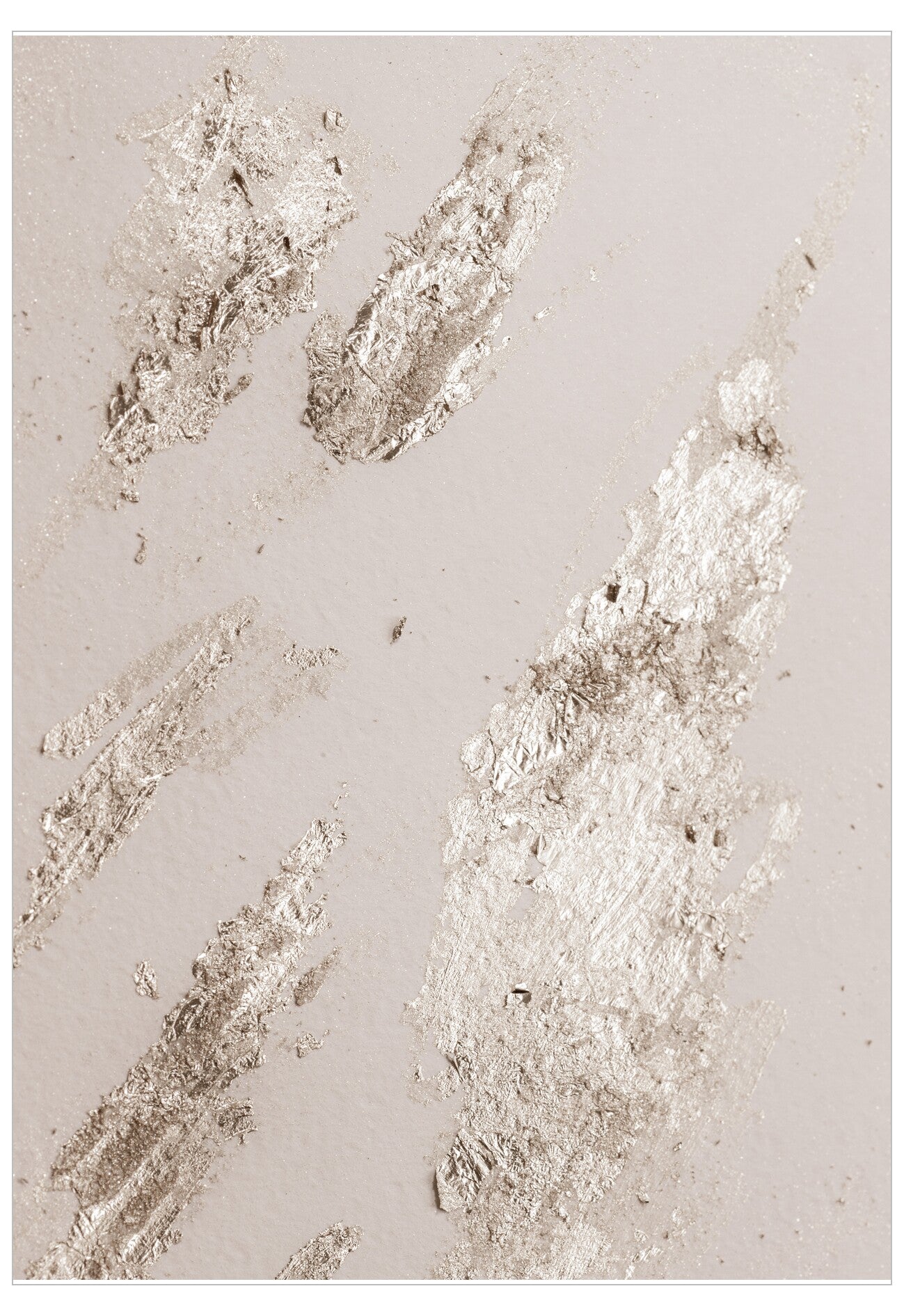 Metallic leaf patterns on a textured beige surface