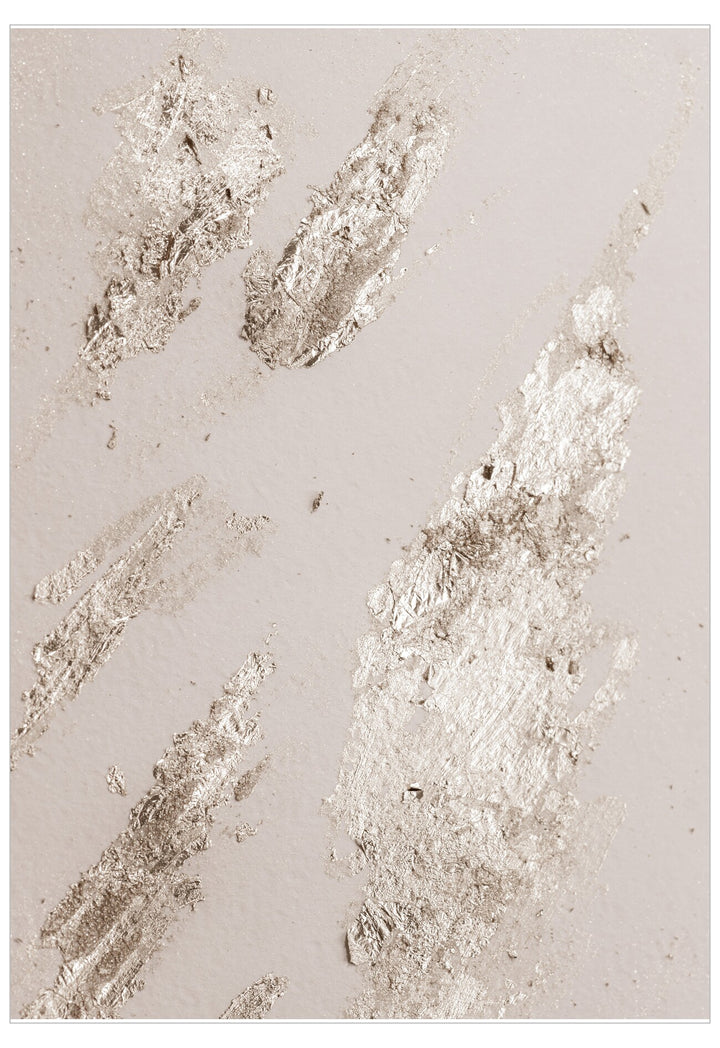 Metallic leaf patterns on a textured beige surface