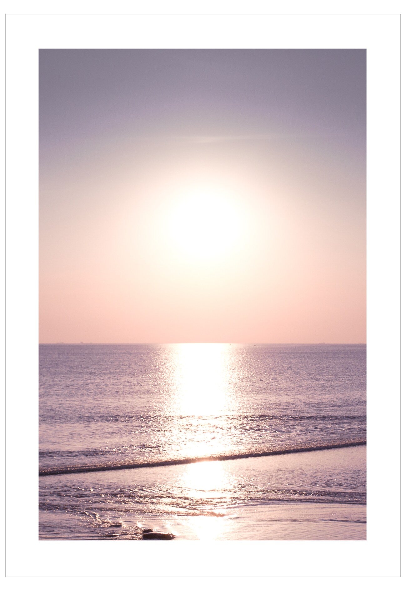 Sunset over the ocean with a soft gradient sky