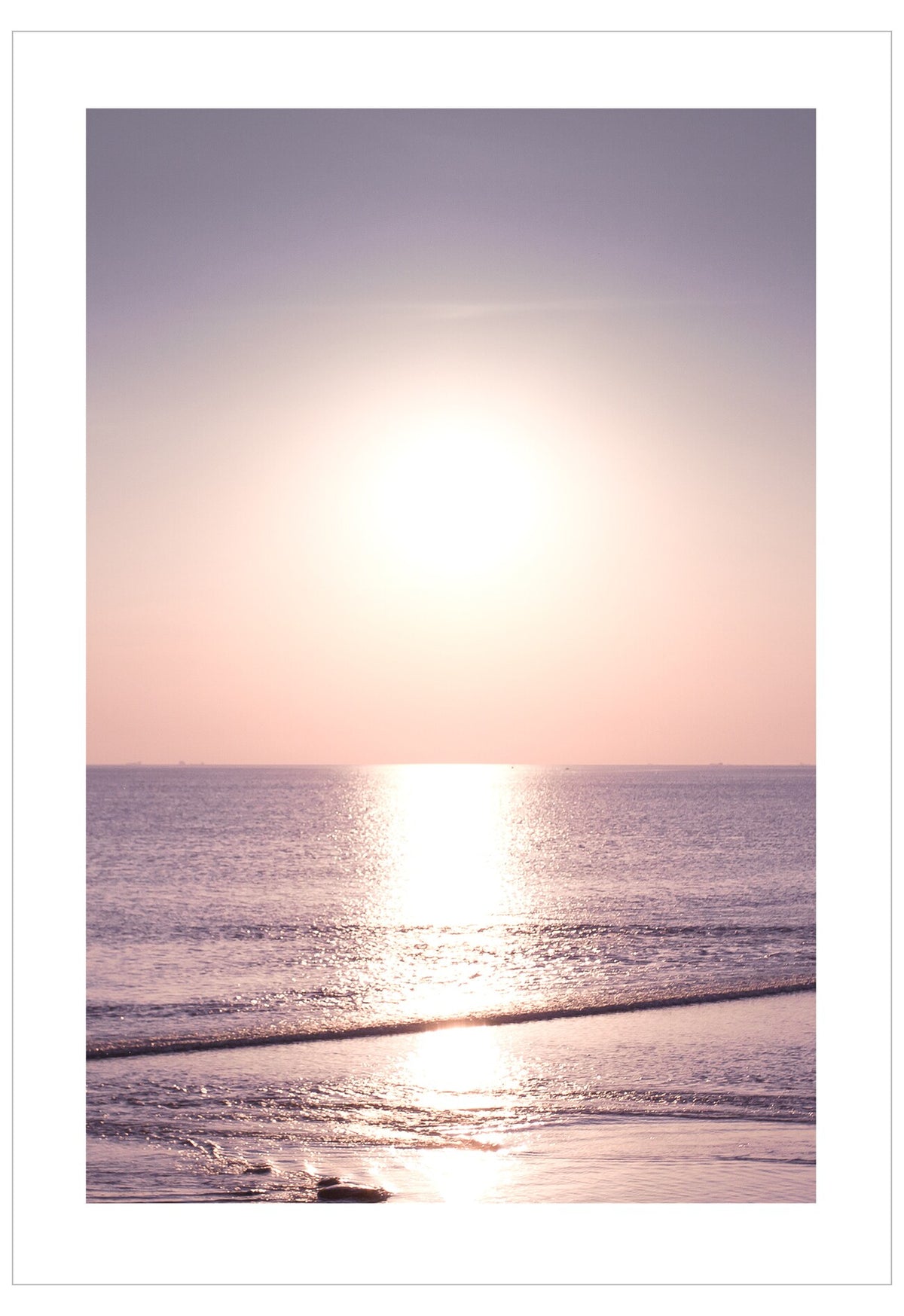 Sunset over the ocean with a soft gradient sky