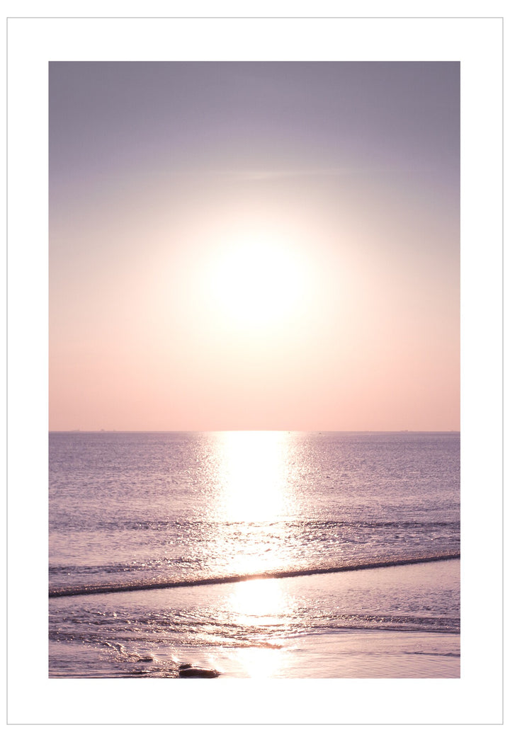Sunset over the ocean with a soft gradient sky