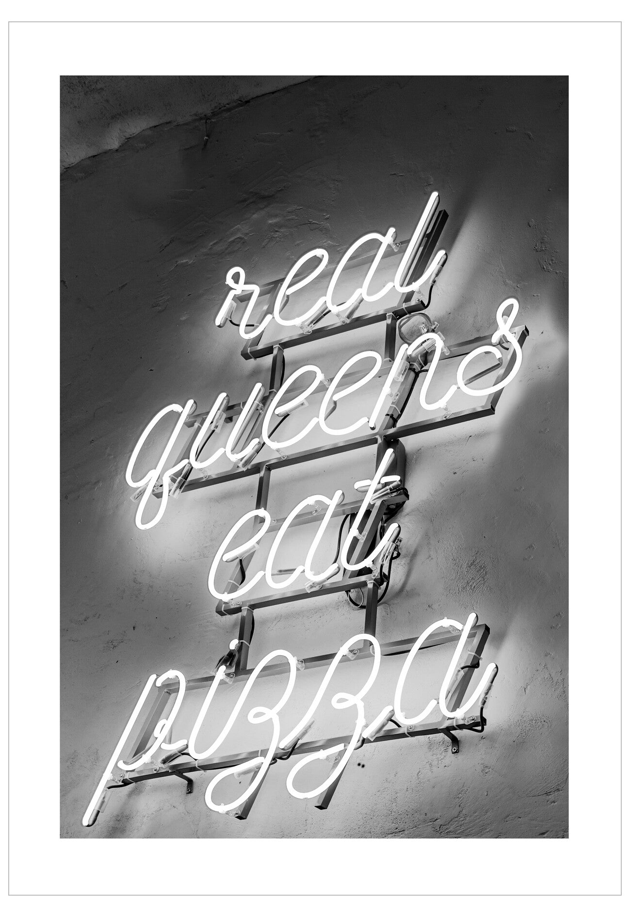 Neon sign with the text 'real queens eat pizza' on a textured wall.