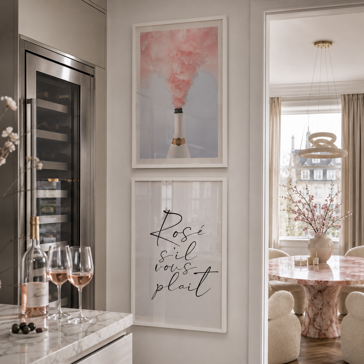 Modern kitchen interior with framed artwork and wine glasses.