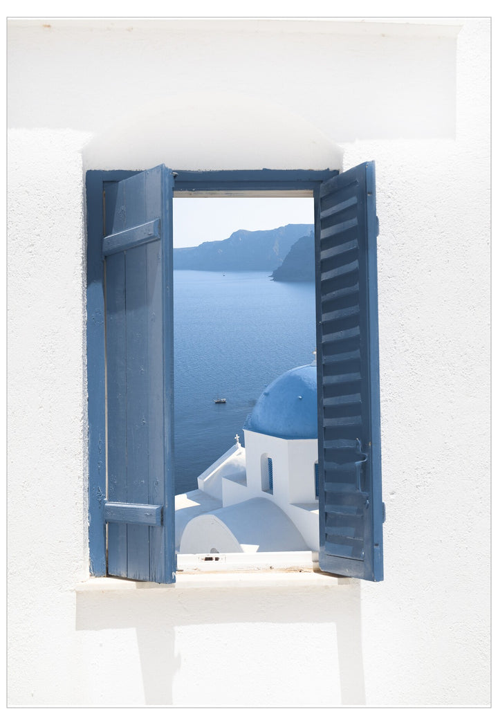 Open window with blue shutters showing a view of a blue-domed church and ocean.