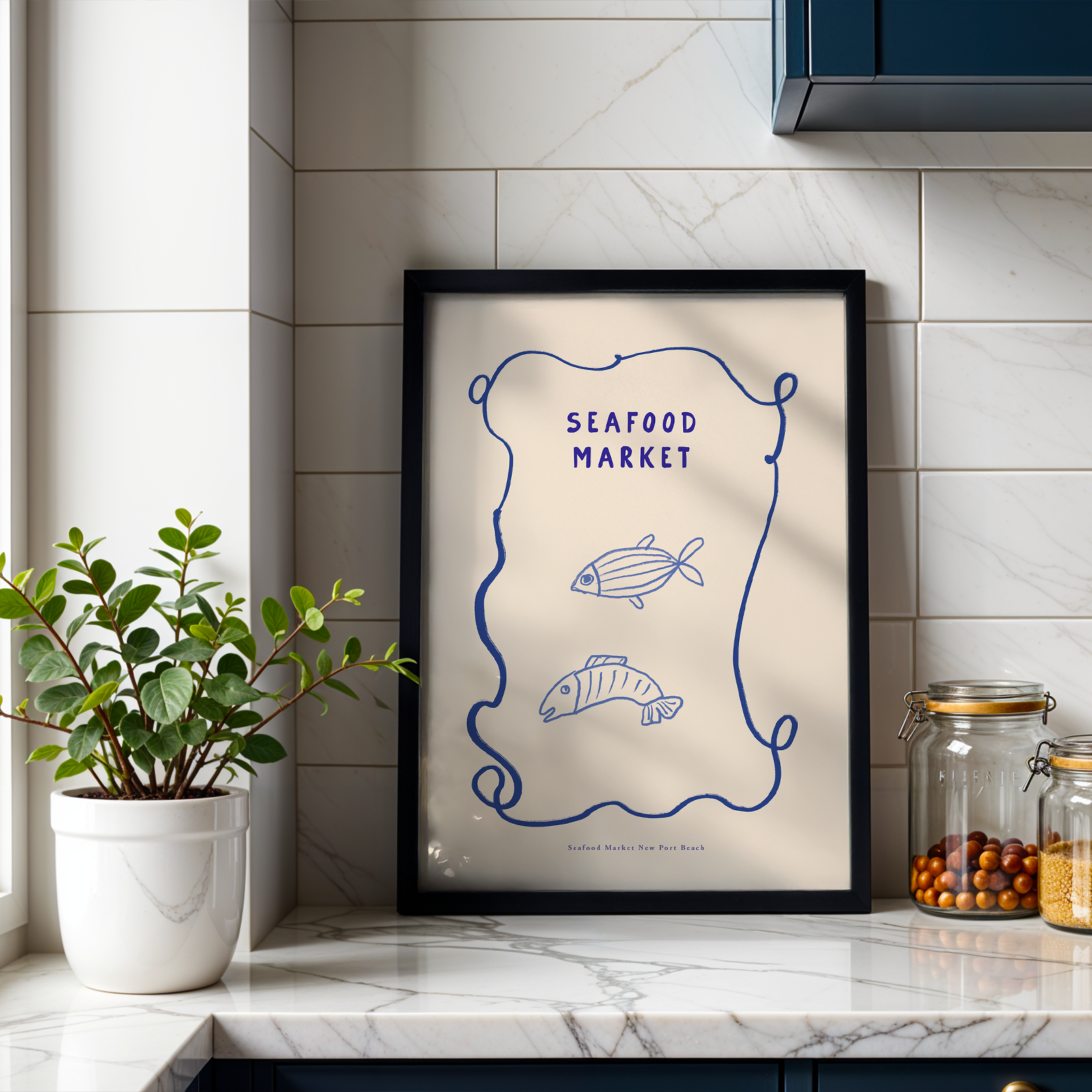 Kitchen counter with a framed print titled 'Seafood Market' and kitchen items.