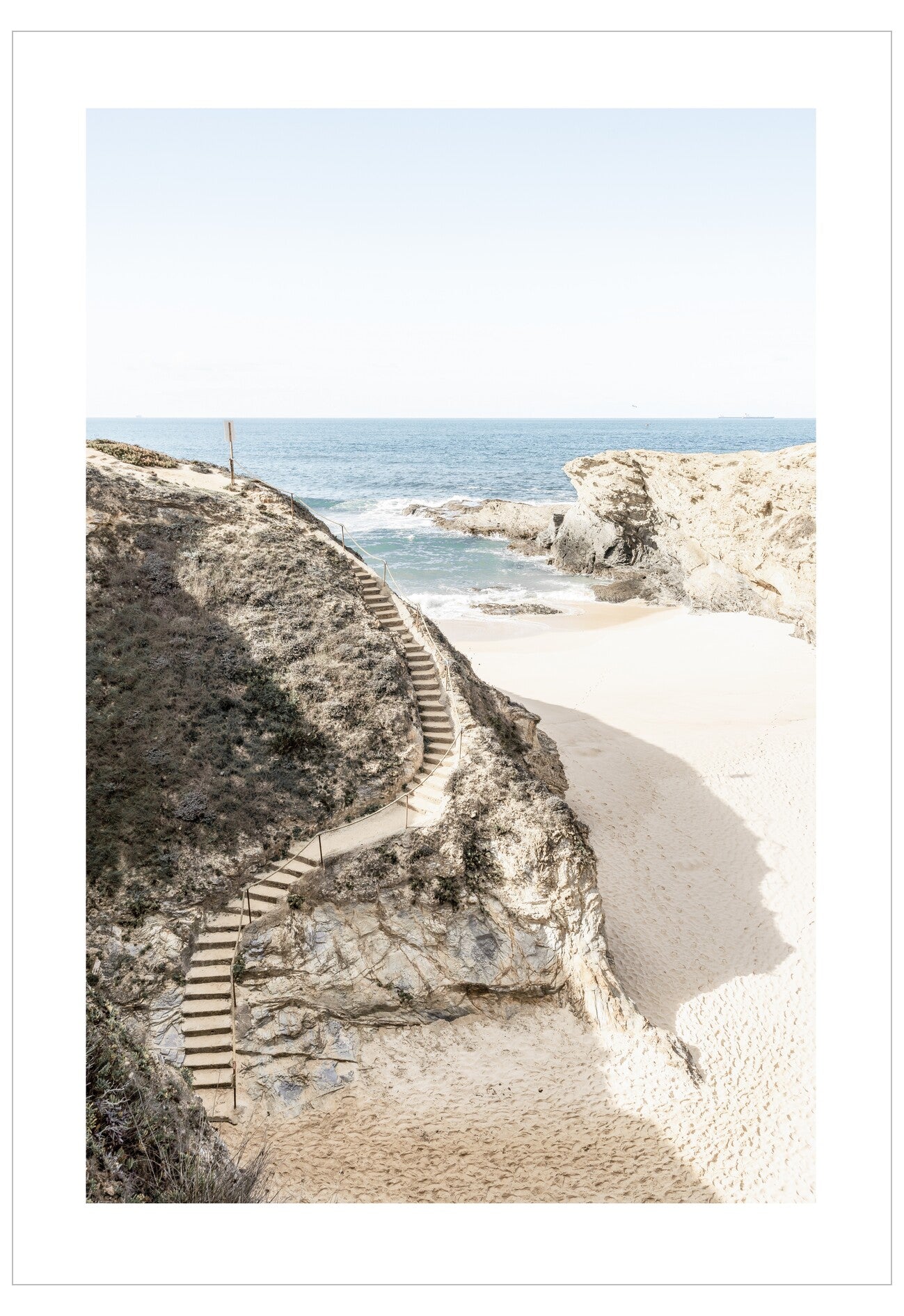 Step pathway leading down to a beach with ocean view