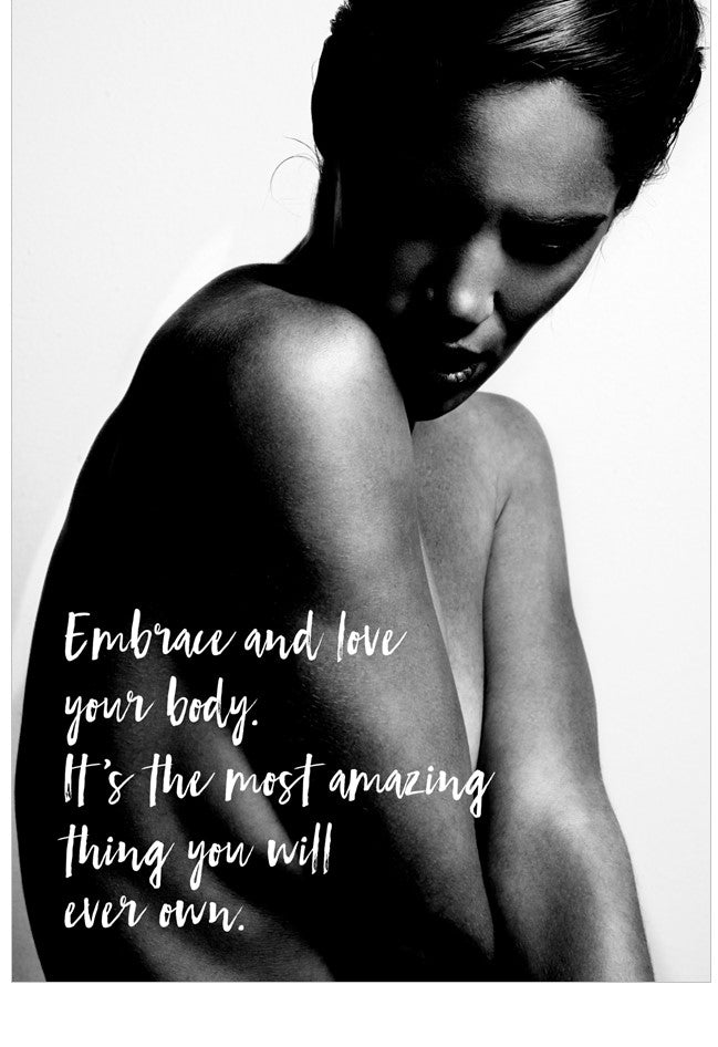 Black and white image of a person with a motivational quote about embracing and loving one's body.