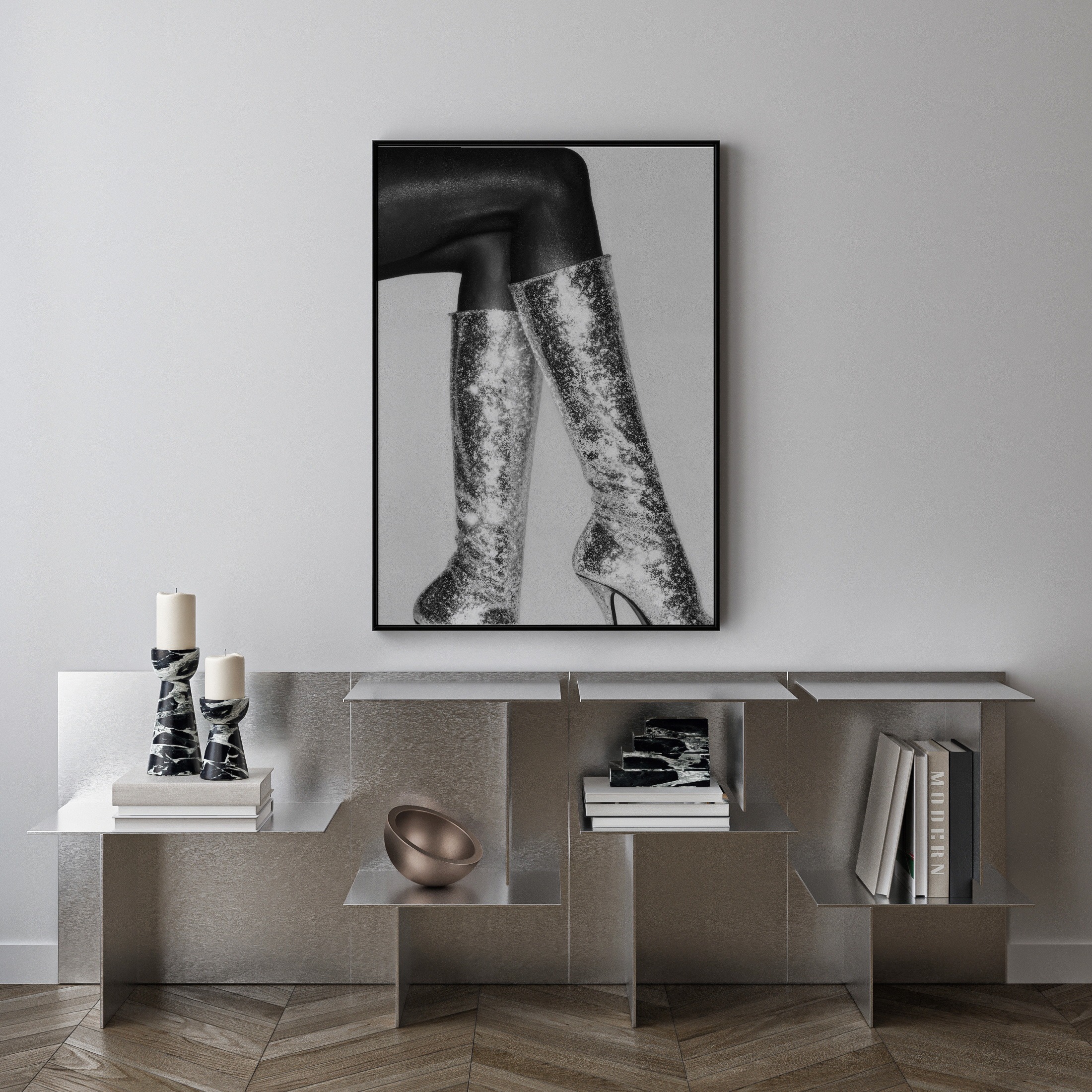 Modern interior with a console table, decorative items, and a framed black and white photo on the wall.