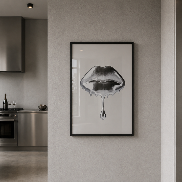 Framed artwork of lips on a wall in a modern kitchen.