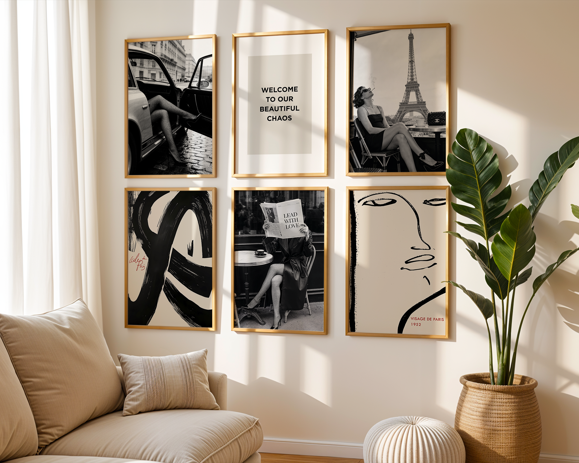 Living room with wall art featuring black and white images and a plant.