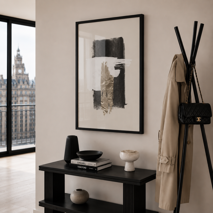 Modern interior with abstract art, coat rack, and decor items.