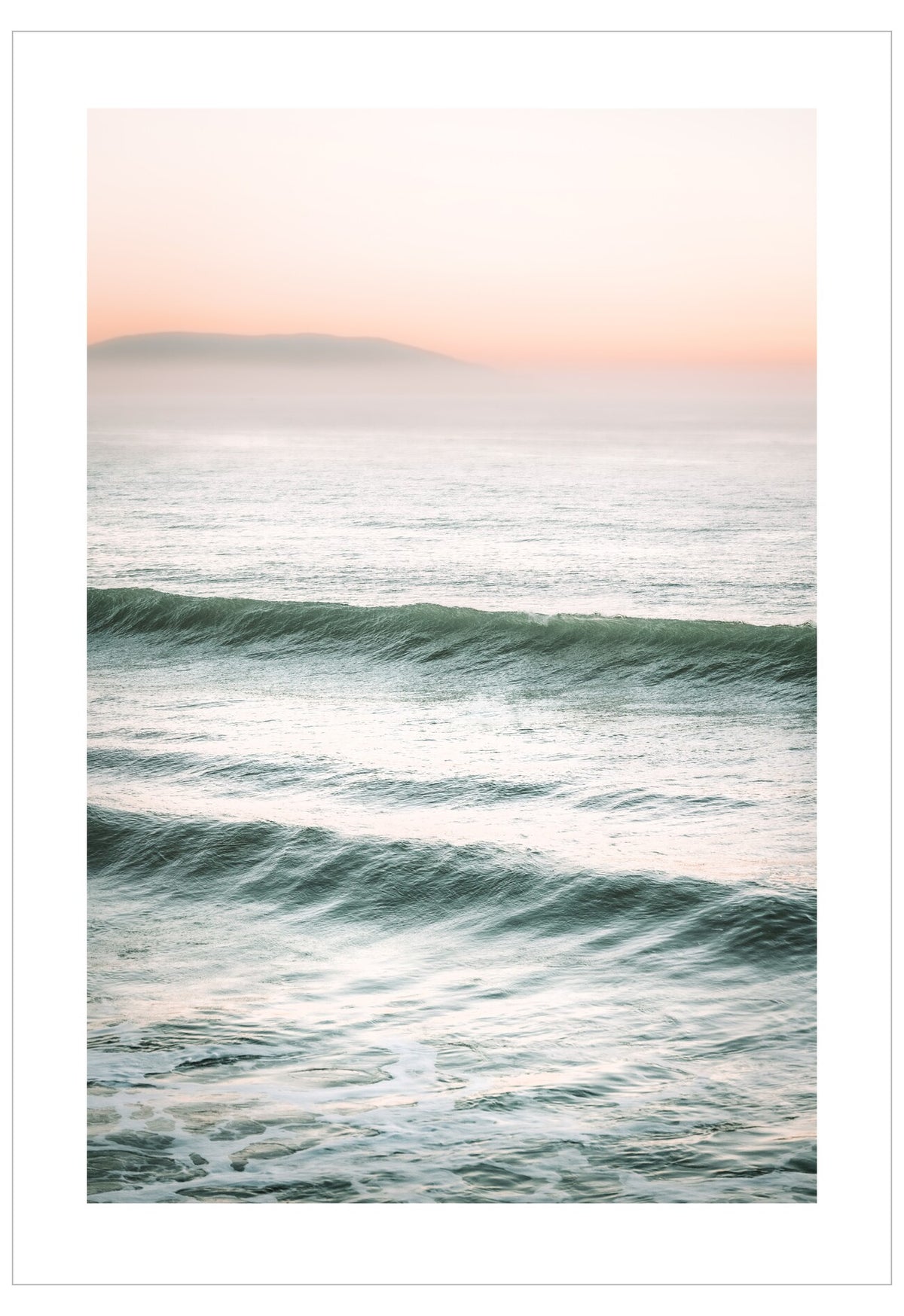 Ocean waves with a soft pink sky