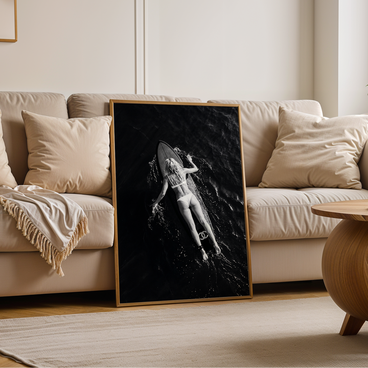 Woman surfing poster in a living room