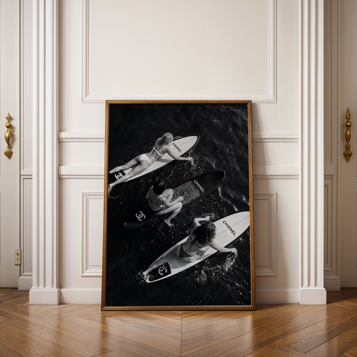 black and white photography image of women surfing on designer surf boards