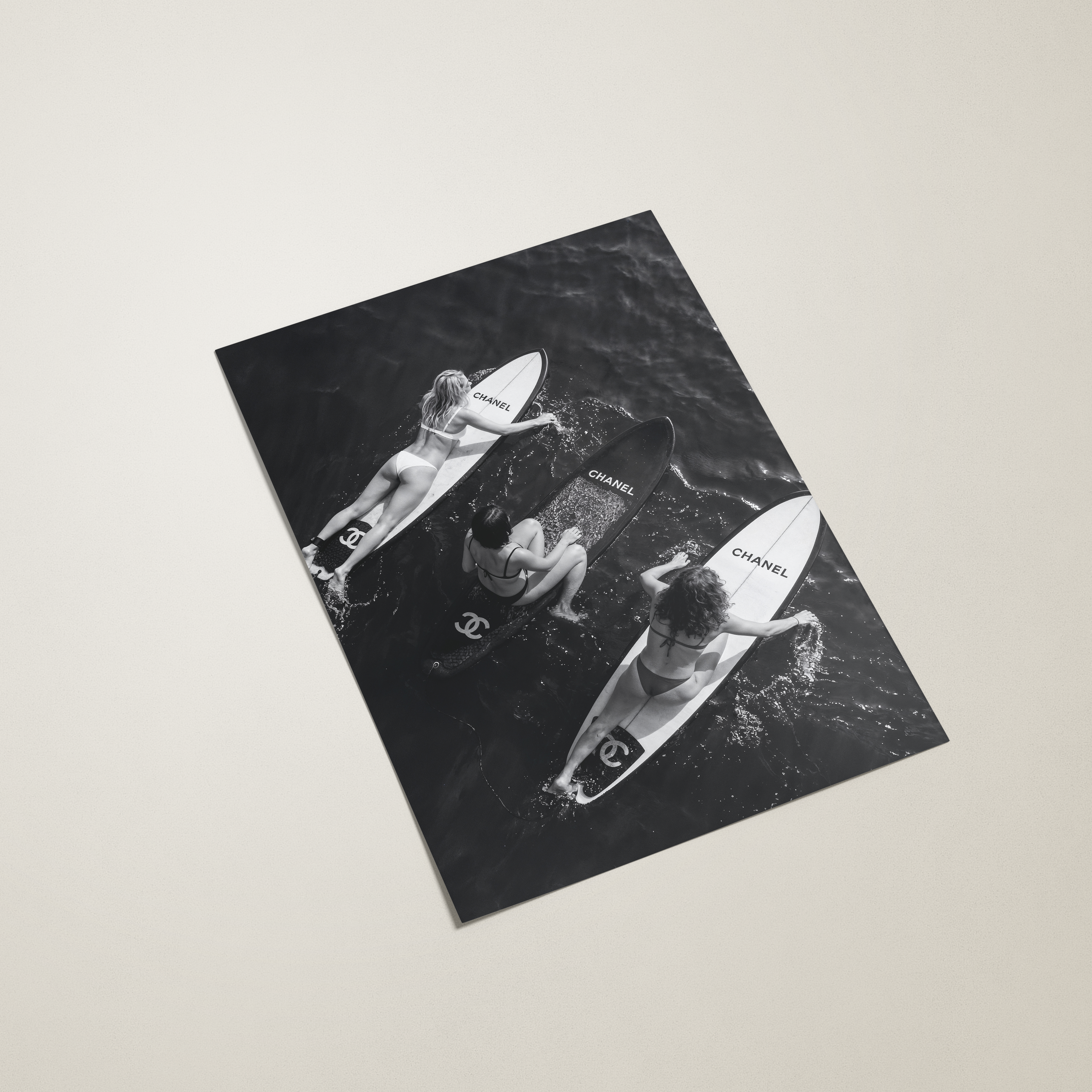 black and white photography print of women surfing