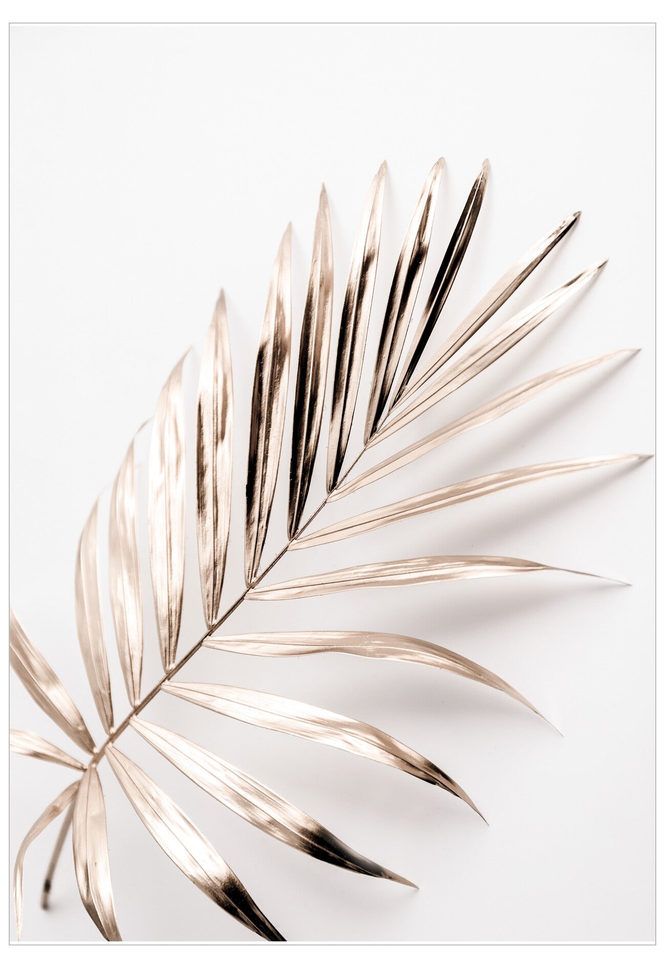 Decorative wall art with gold palm leaf design on a white background