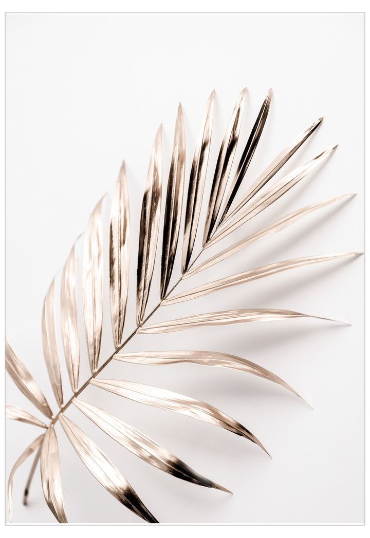 Decorative wall art with gold palm leaf design on a white background