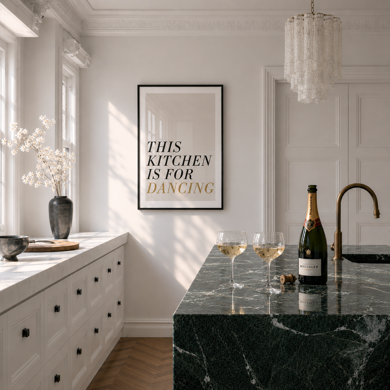Modern kitchen with black marble island, champagne bottle, and decorative poster.