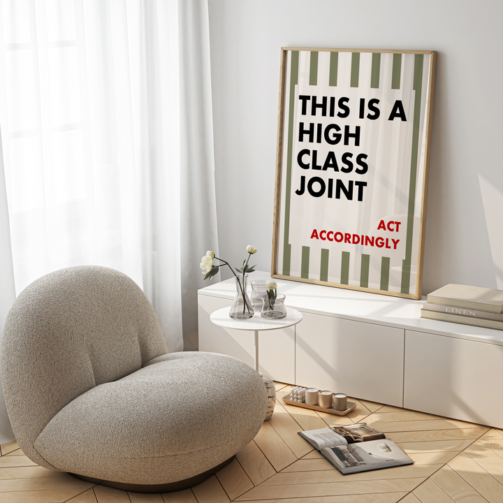 Modern living room with a textured armchair, coffee table, and decorative wall art.