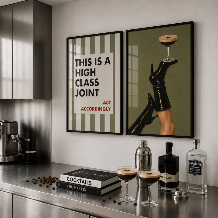 Modern kitchen with cocktail-making setup and framed art on the wall.