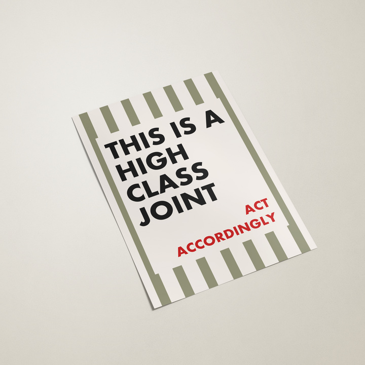 Book with text 'This is a high class joint. Act accordingly' on a light background