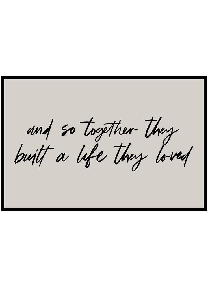 Textual quote poster 'and so together they built a life they loved' on a beige background with a black frame.
