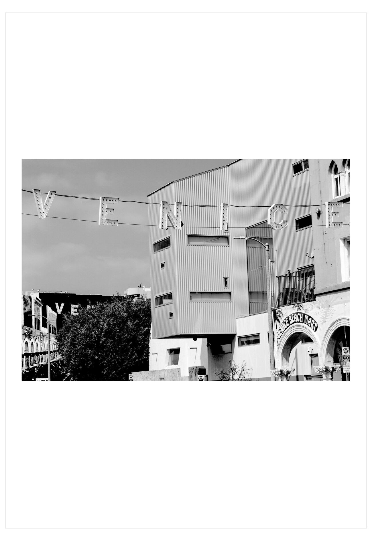 Black and white photograph of a building with decorative letters spelling 'LOVE' above it.