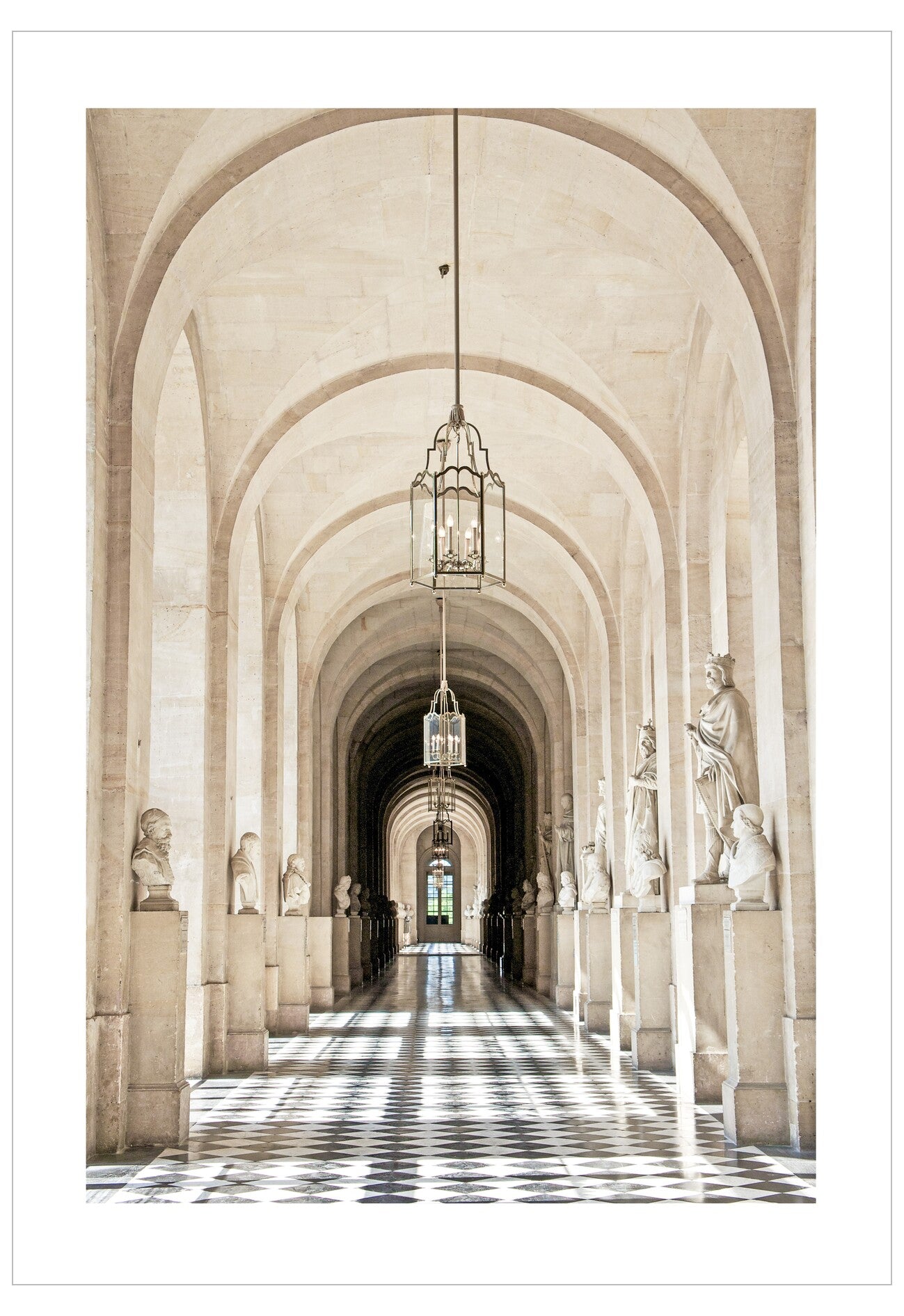 Long, elegant hallway with arches, statues, and hanging chandeliers.