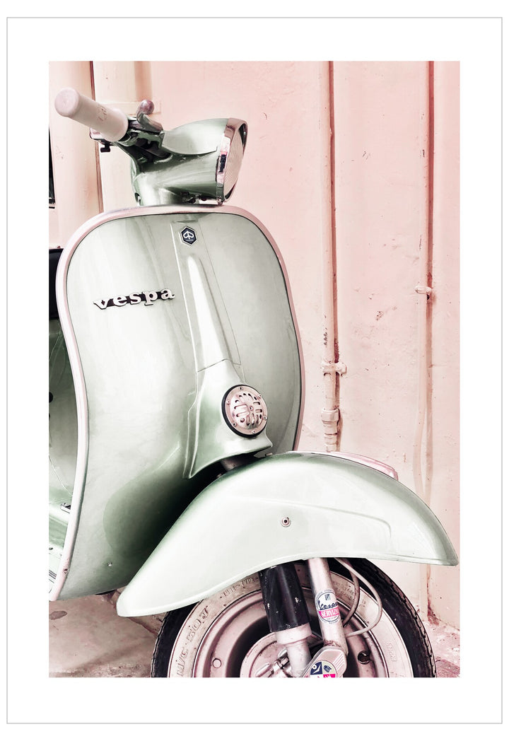 Vintage scooter against a pink wall