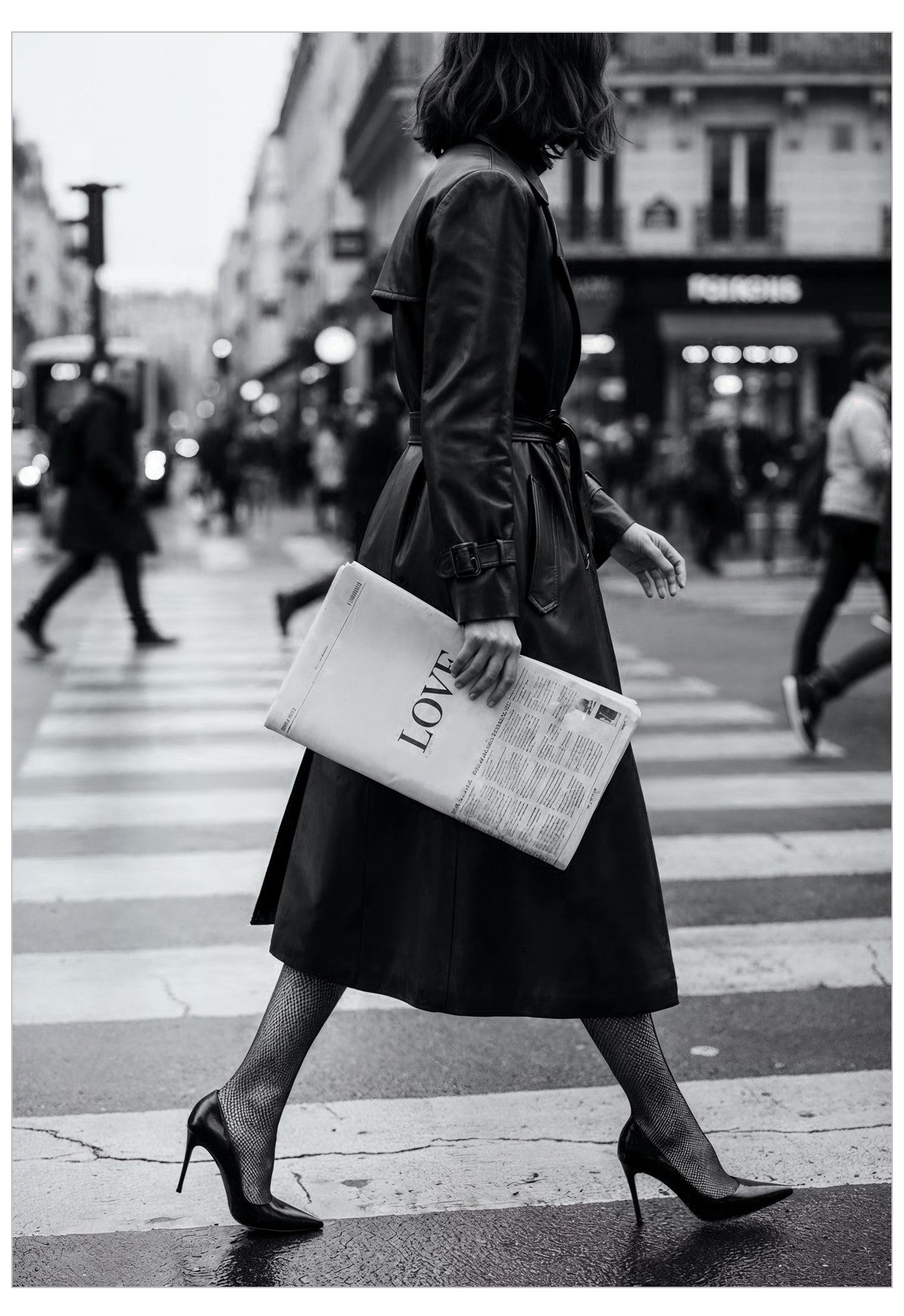 Woman crossing a street holding a newspaper with 'LOVE' printed on it.