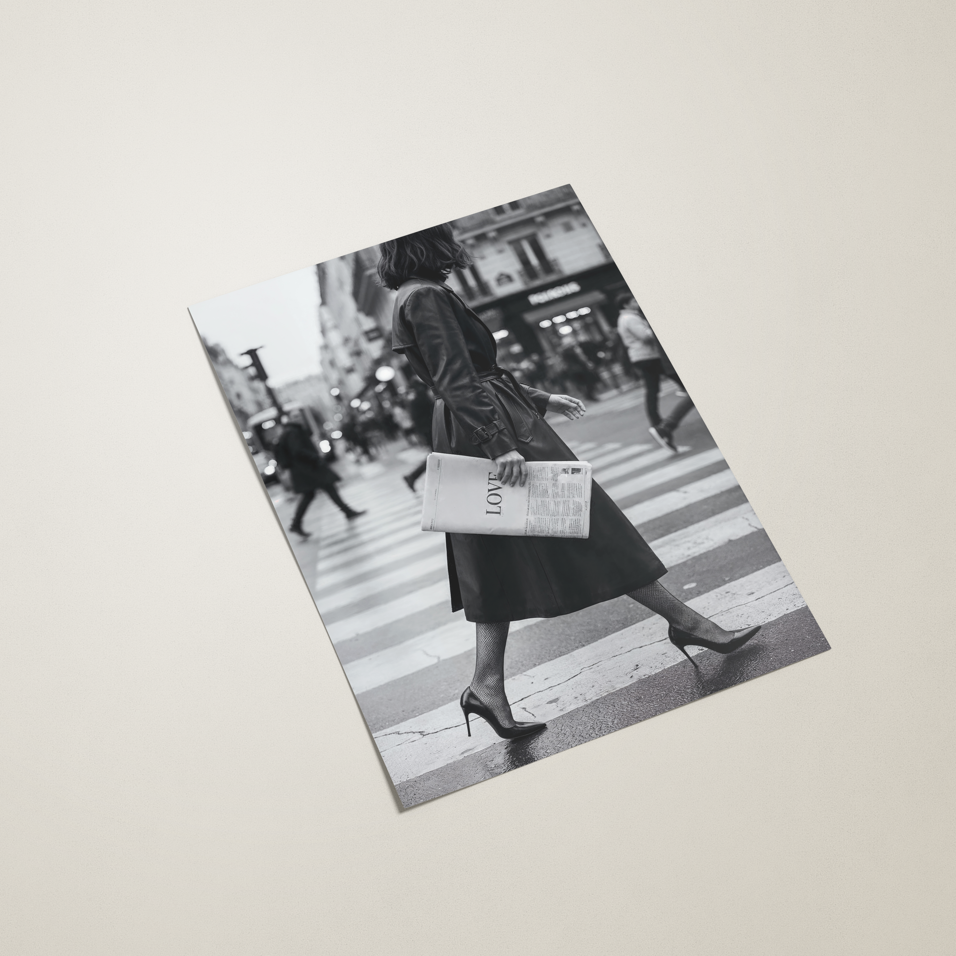 Black and white photo of a person crossing a street on a printed paper