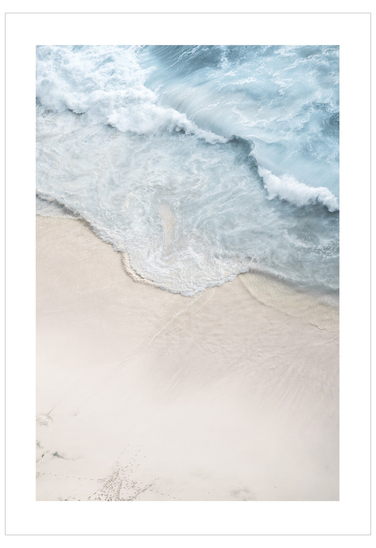 Close-up of waves crashing onto a sandy beach