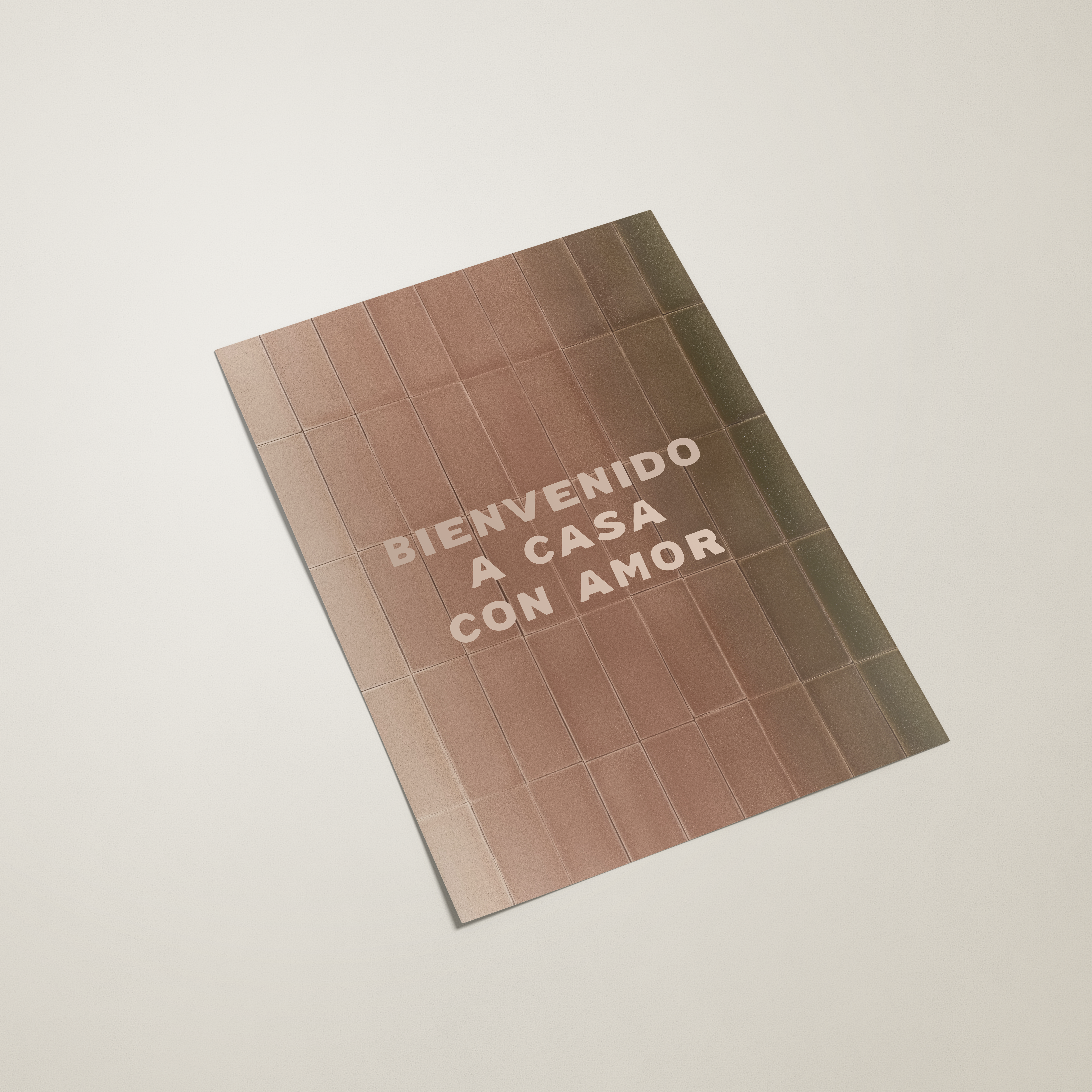 Tile-patterned book cover with text 'BIENVENIDO A CASA CON AMOR' on a light background