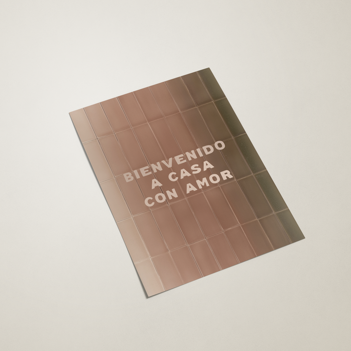 Tile-patterned book cover with text 'BIENVENIDO A CASA CON AMOR' on a light background