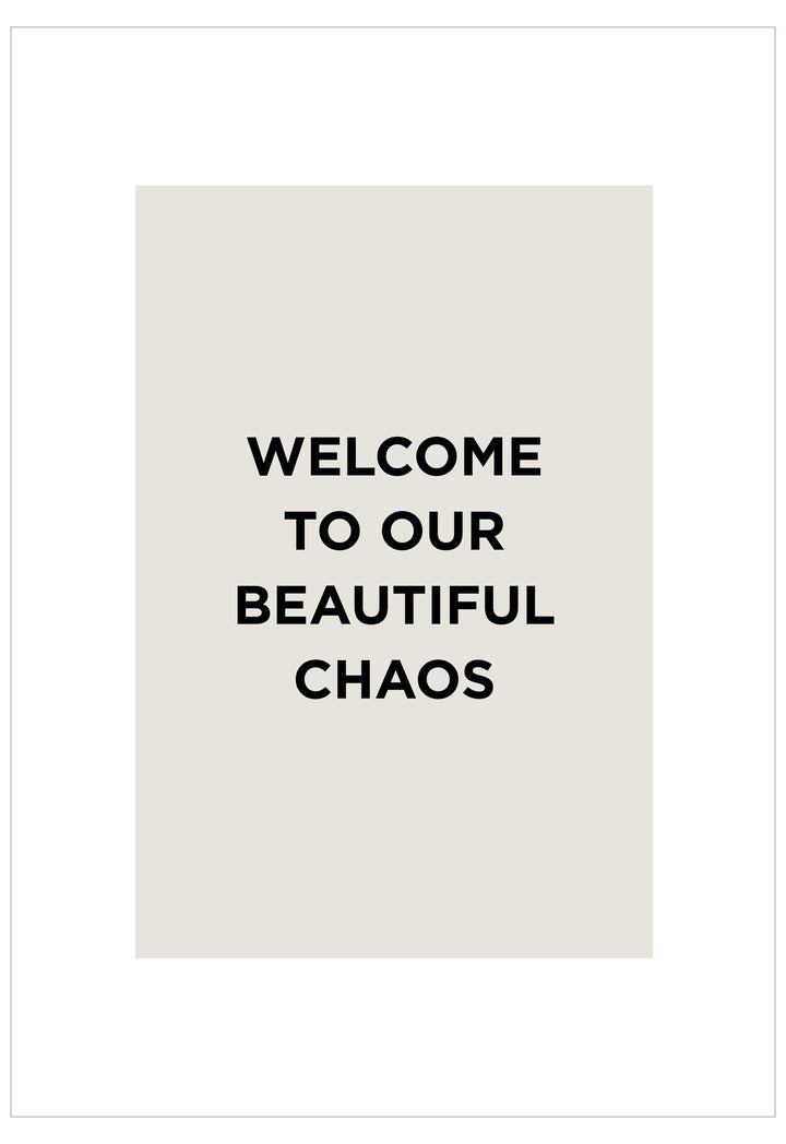 Text 'WELCOME TO OUR BEAUTIFUL CHAOS' on a white background
