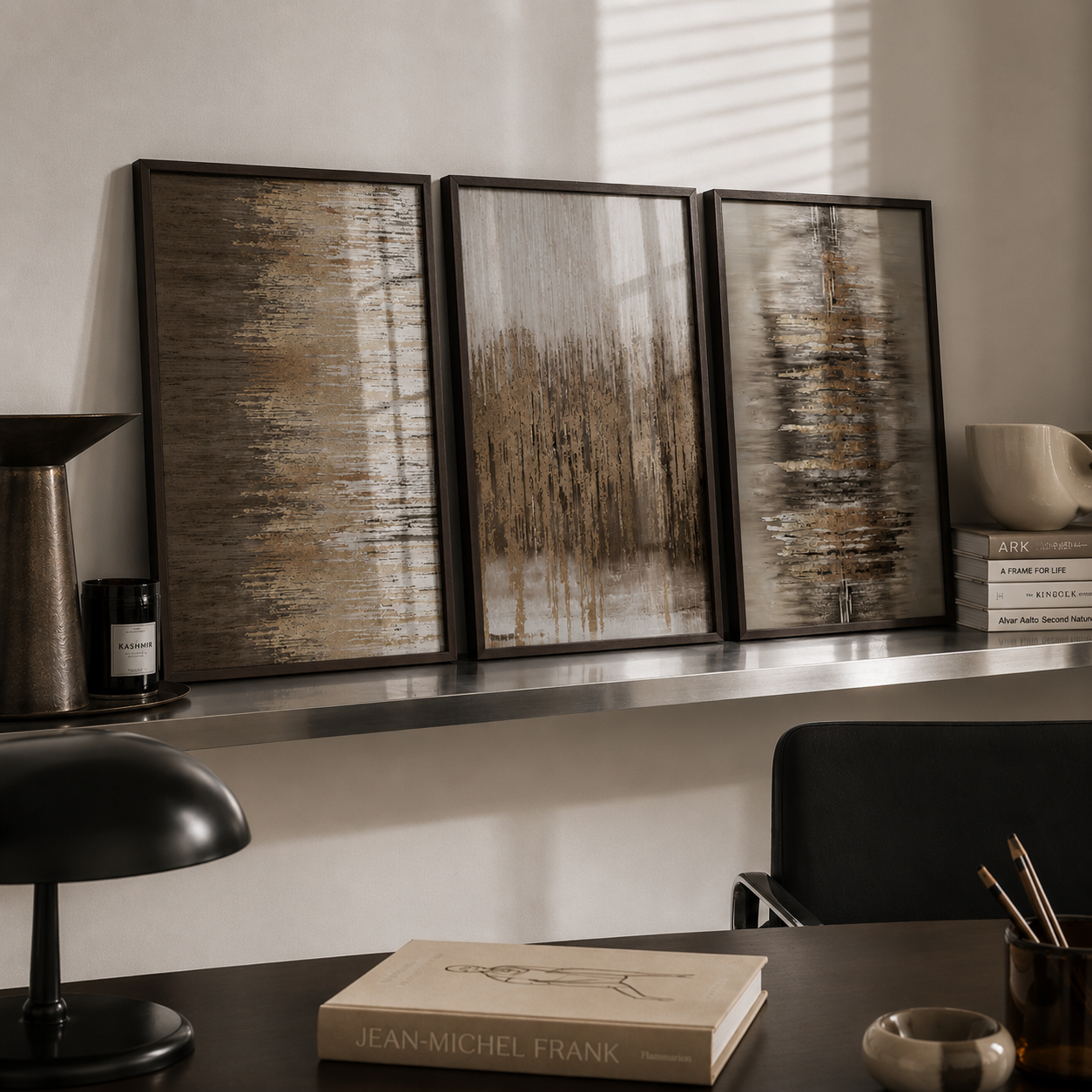 A three-panel framed wall art set with abstract and forest-like textured designs in earthy beige, brown, and gray tones, displayed on a shelf in a styled interior setting.