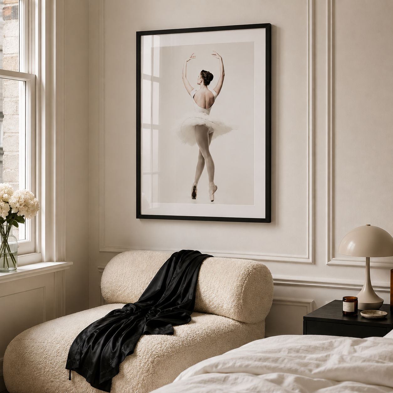Decorative room with a framed picture of a ballerina, a chair with a black jacket, and a nightstand with a lamp.