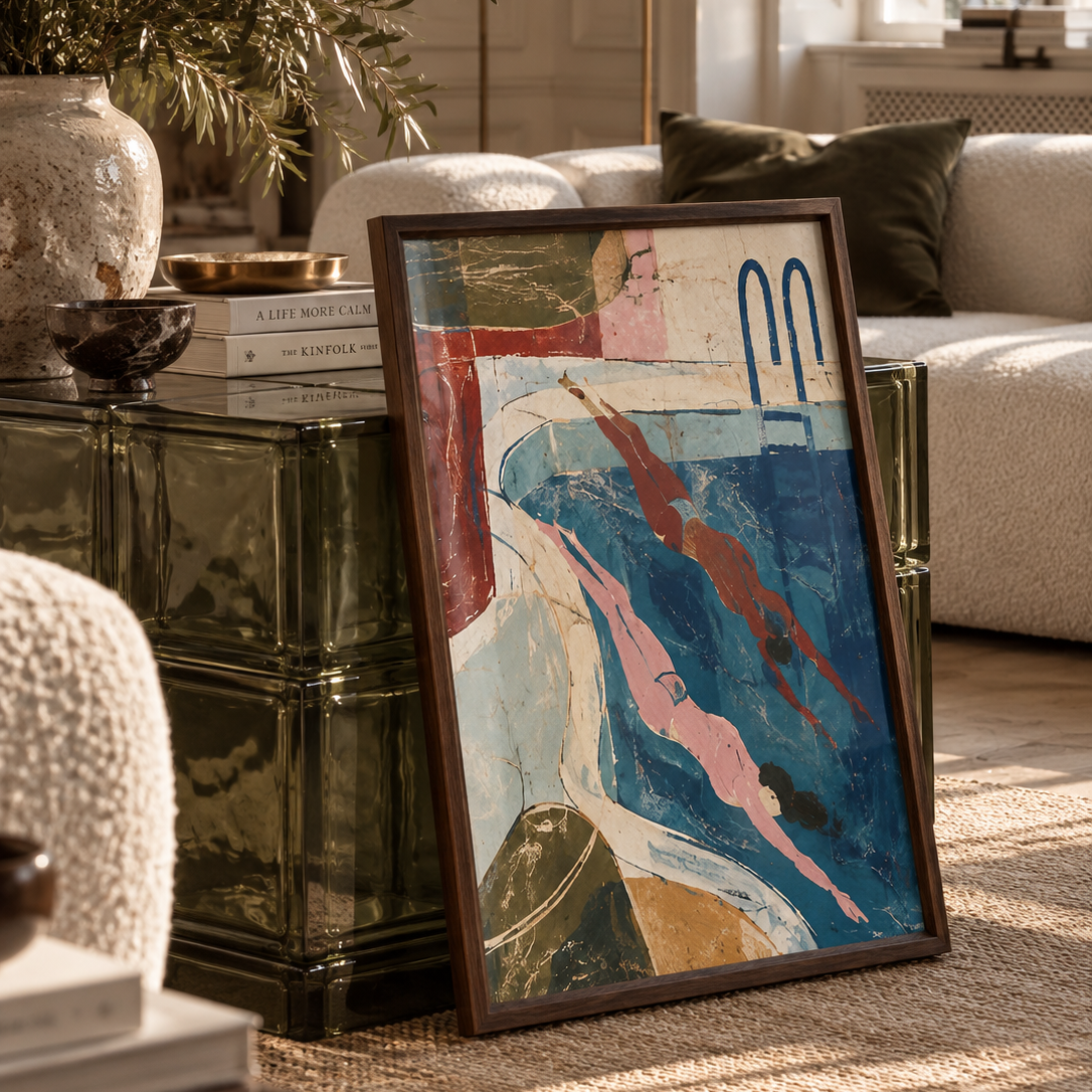 an abstract colourful illustration of two swimmers in a swimming pool in a dark wood frame resting against a glass block coffee table
