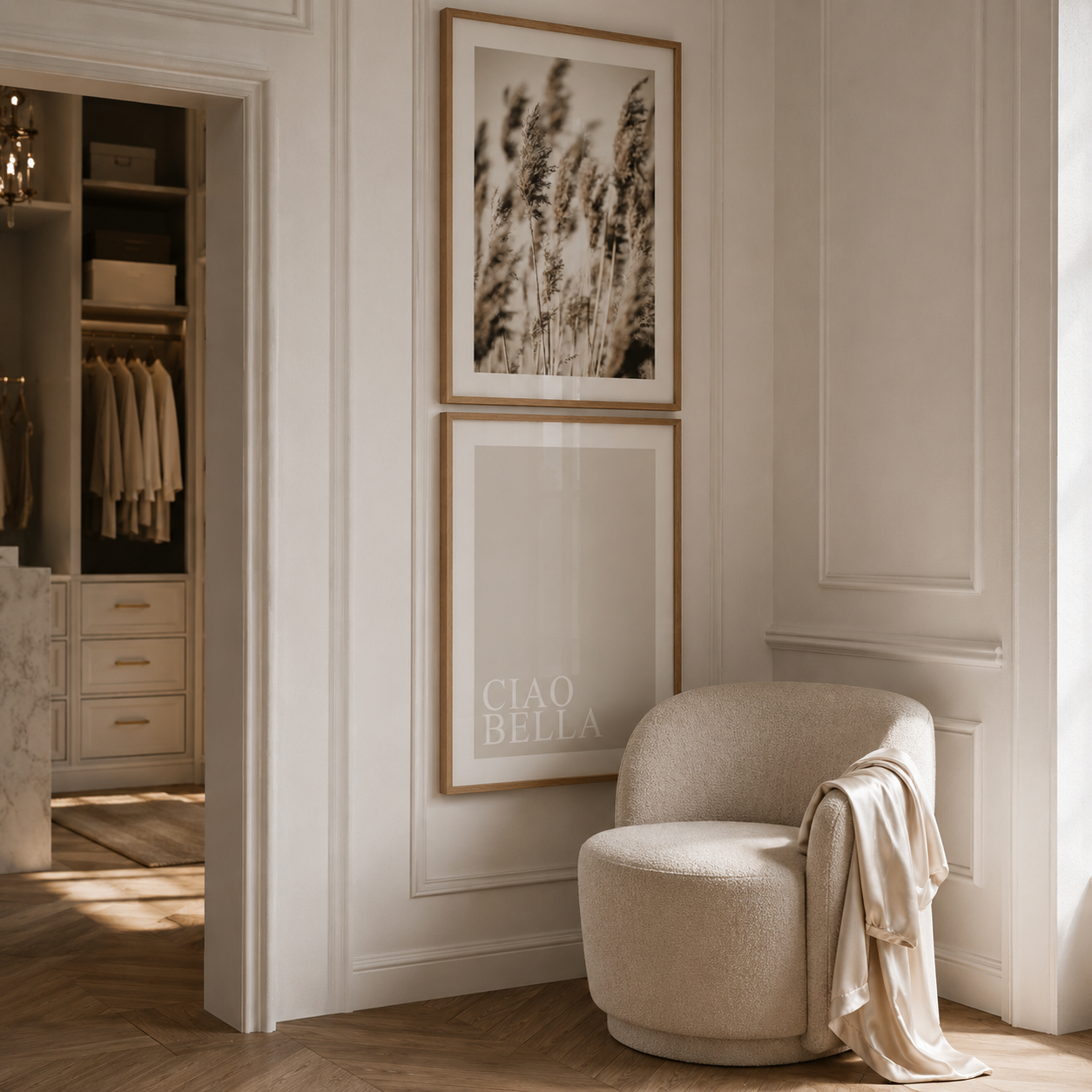 Beige armchair in a stylish room with framed artwork on the wall.